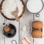 Overhead view of measuring utensils full of various ingredients with a text overlay for Pinterest.