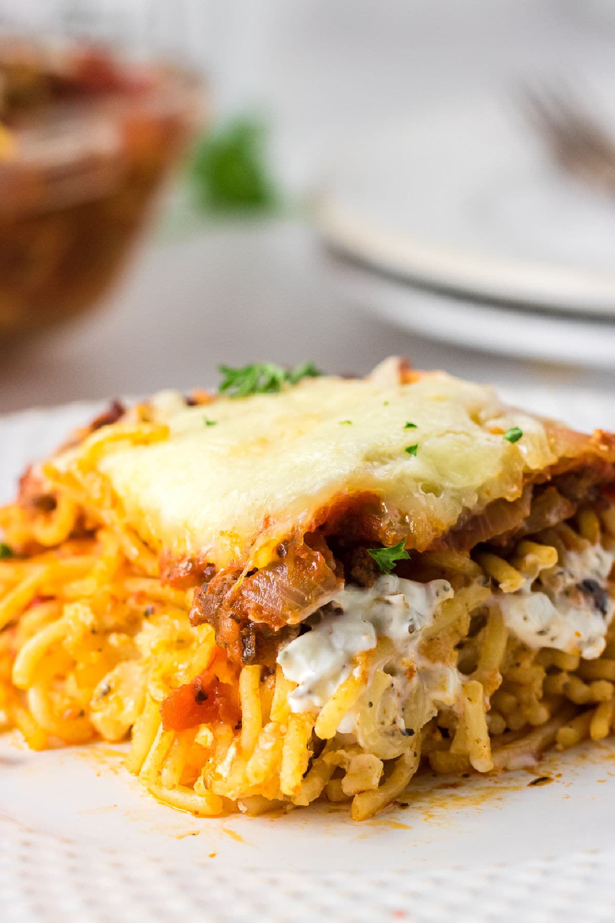 A serving of casserole on a white plate.