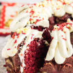 Side view of a piece of cake being removed from the cake plate with text overlay for Pinterest.