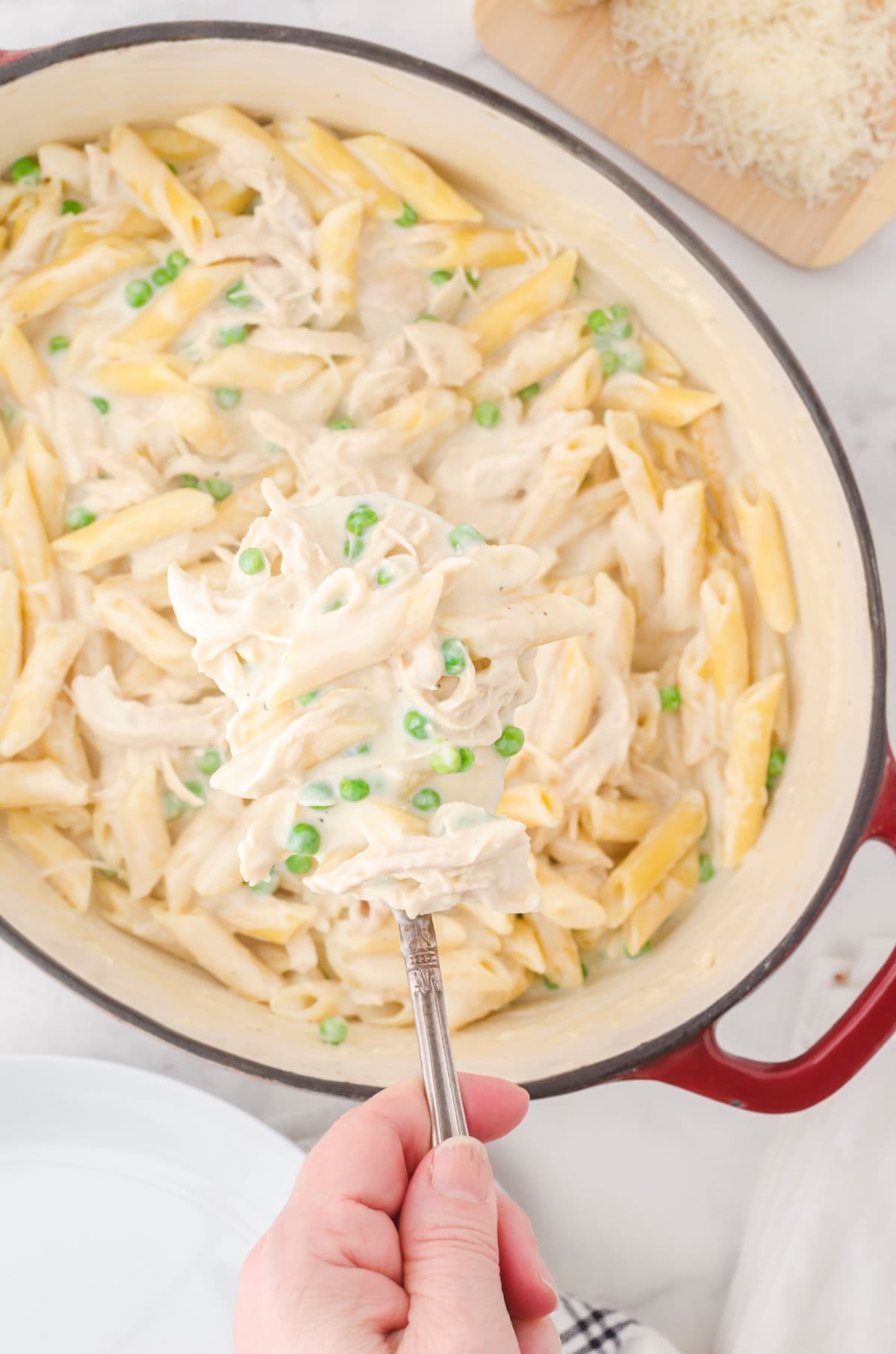 Overhead view of a pan of pasta with a creamy sauce.