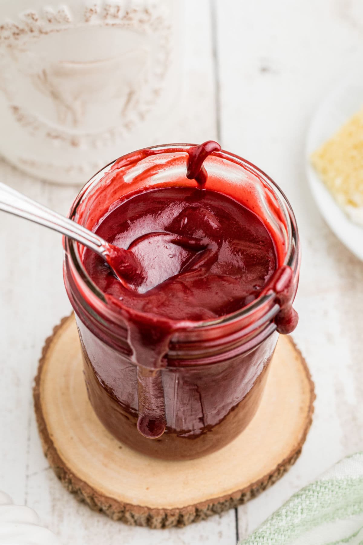 Overhead view of red velvet hot fudge sauce in a jar.