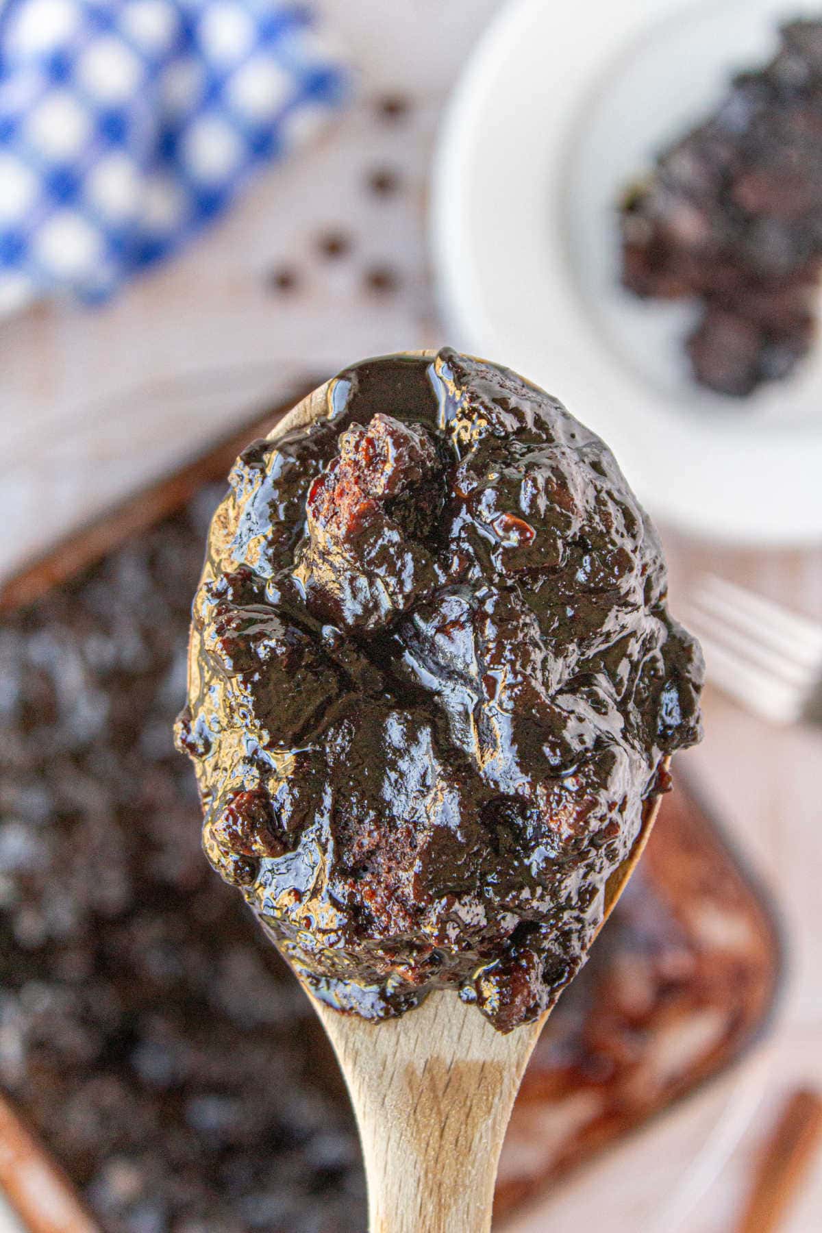 Spoonful of chocolate cobbler being served.