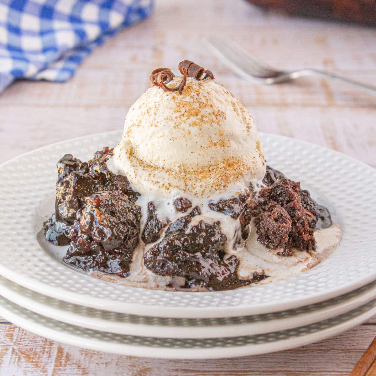 Feature image showing a closeup of the cobbler on a plate with a scoop of ice cream.