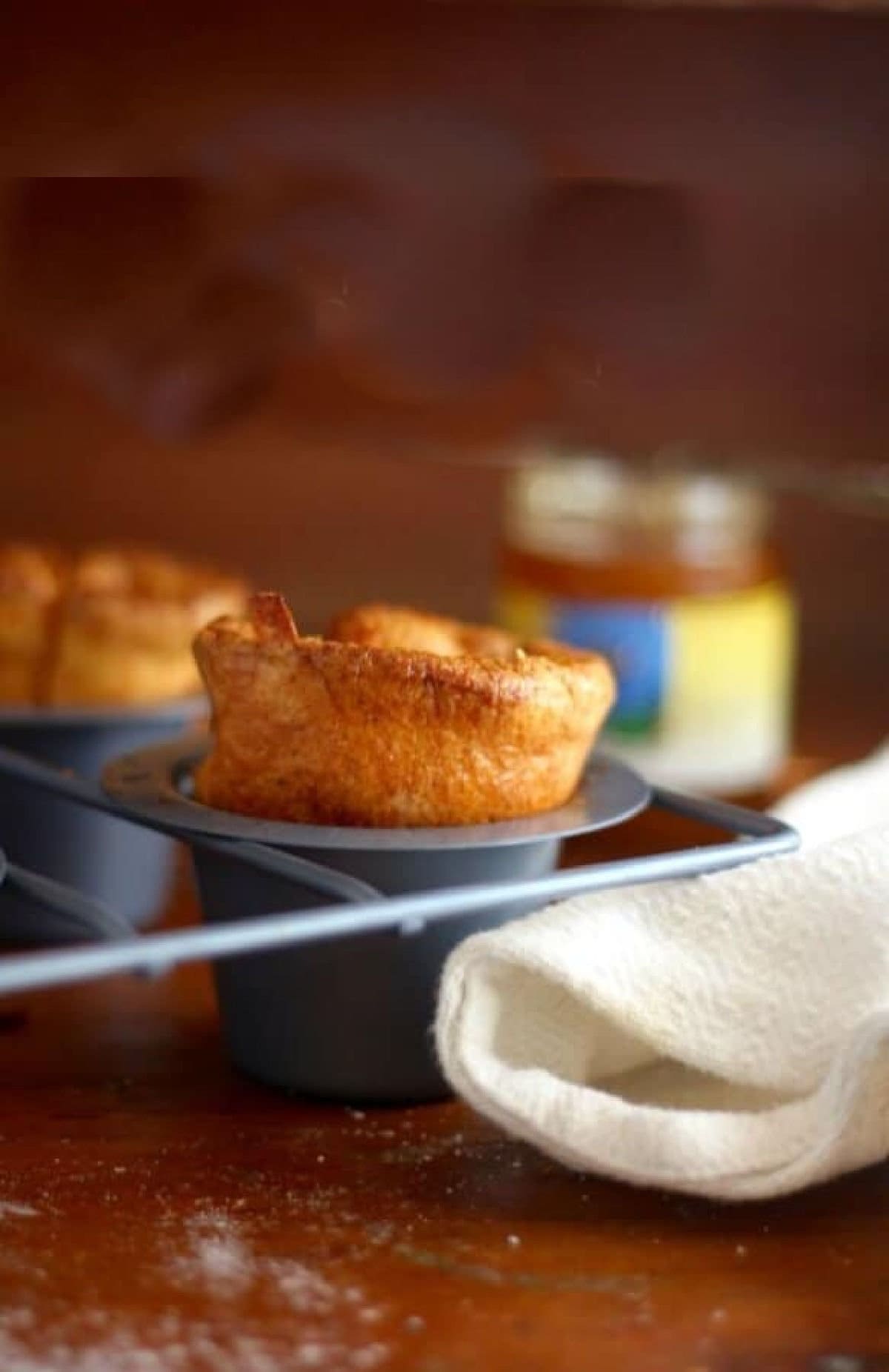 Cornmeal popovers in a pan.