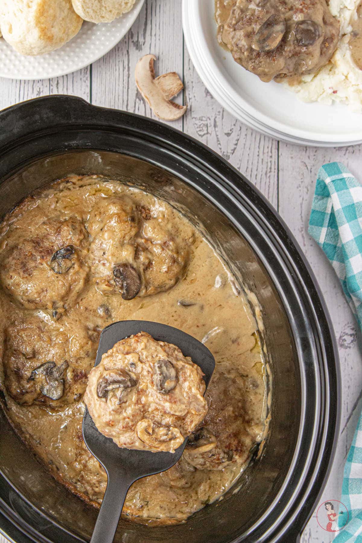 Salisbury steak in a rich mushroom gravy in a slow cooker.