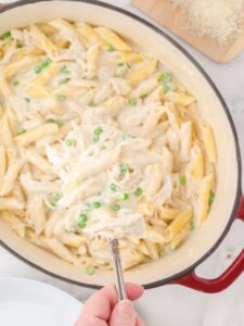 Overhead view of a pan of pasta with a creamy sauce.