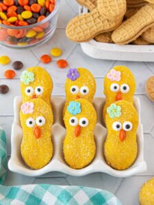 Decorated cookies drying in a white dish.
