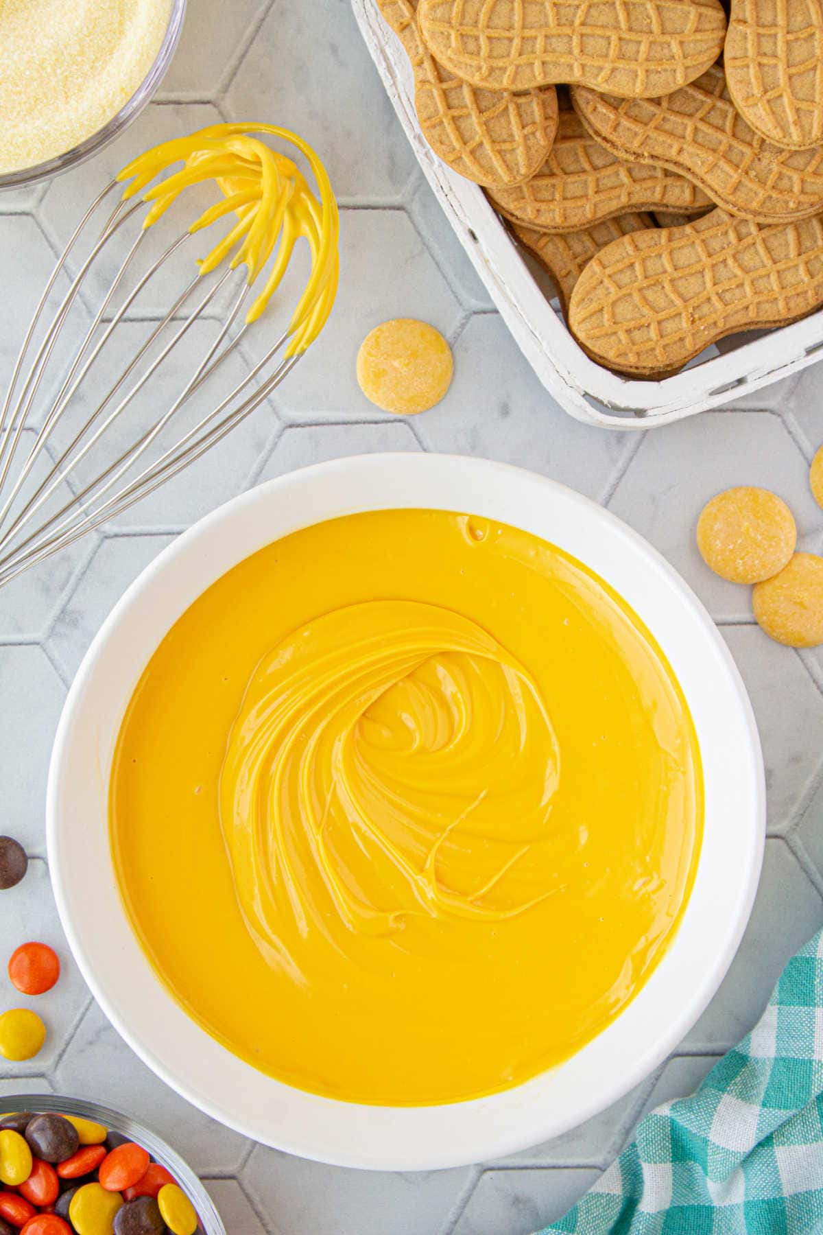 A bowl of yellow melted candy melts.