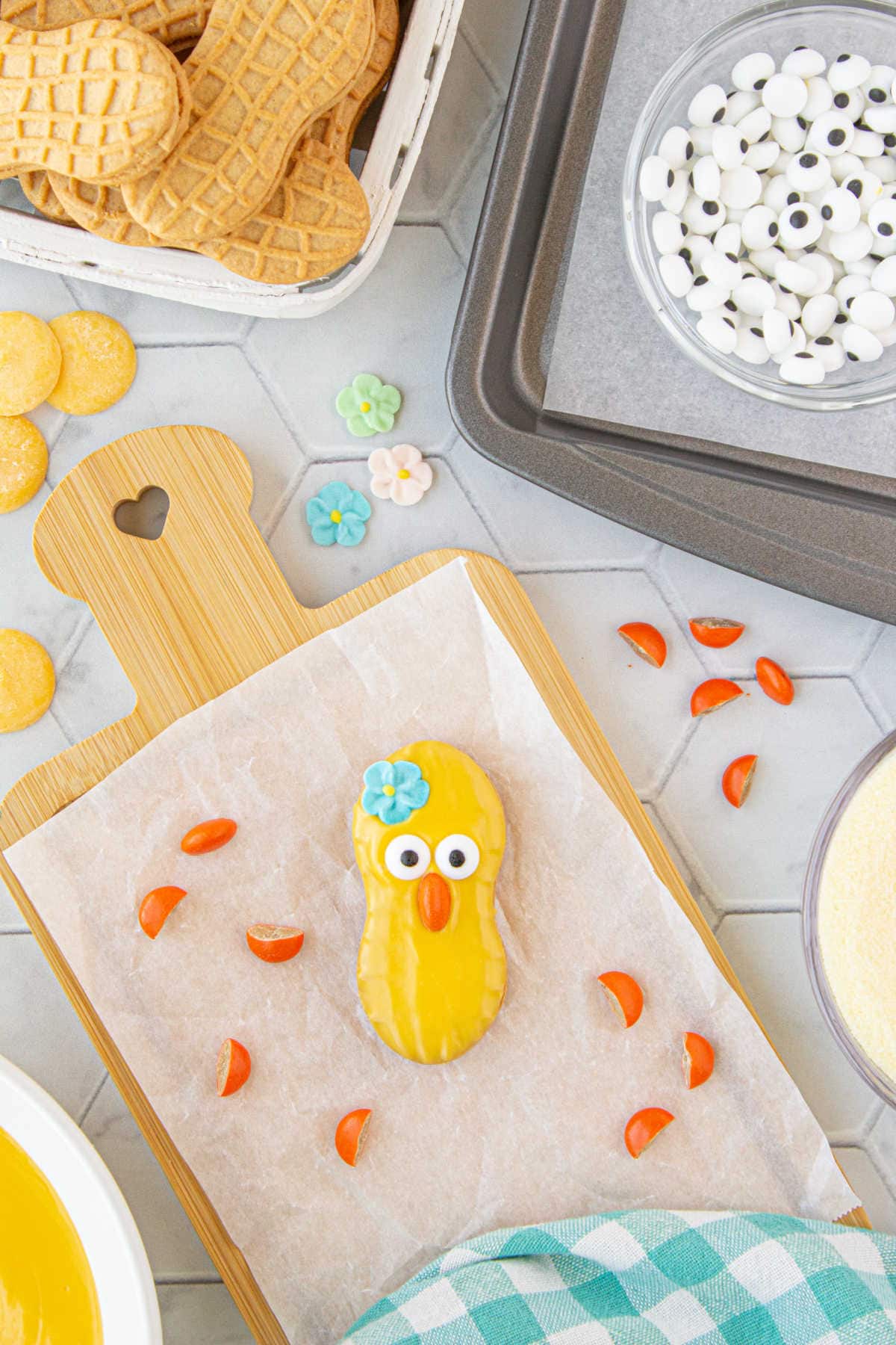 Overhead view of a Nutter Butter chick cookie with a blue flower.