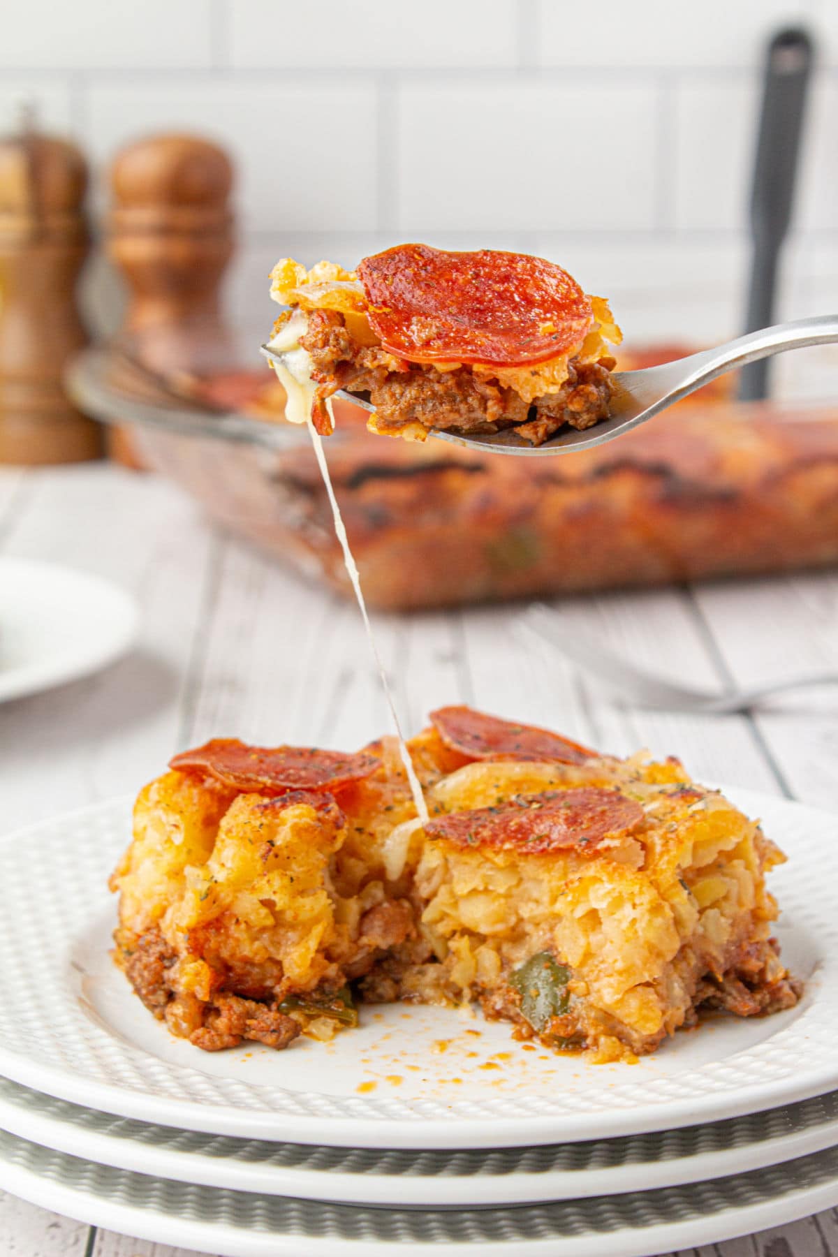 Pizza tater tot casserole on a plate.