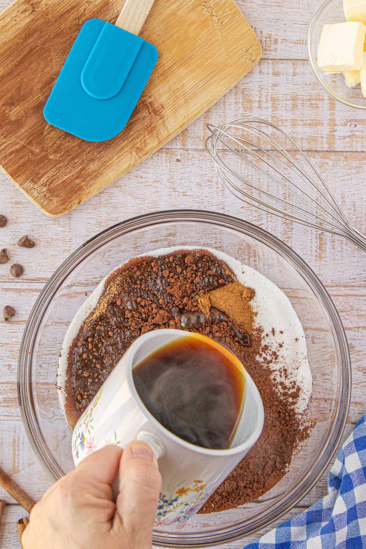 Pouring coffee into the cocoa mixture.