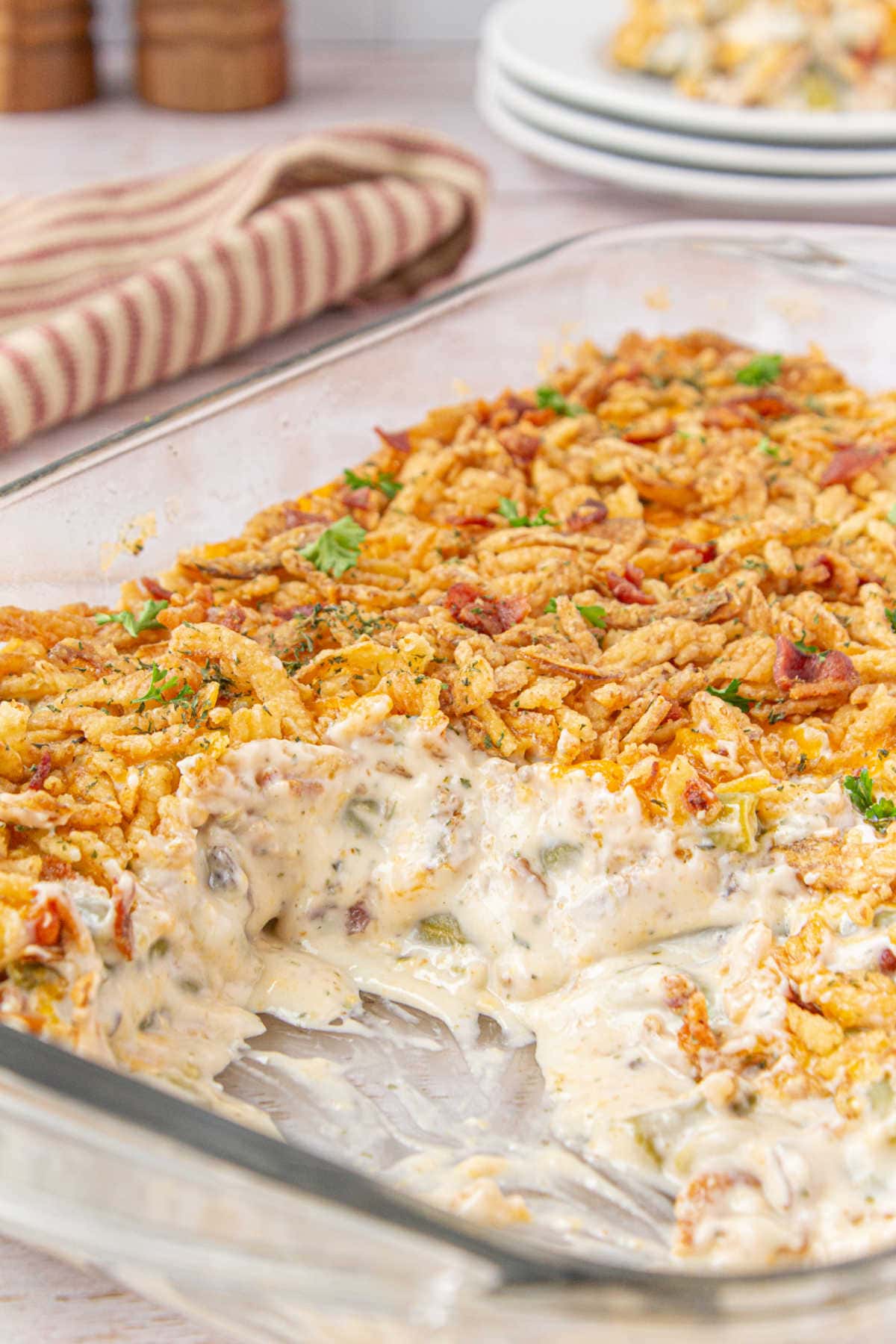 Casserole in a glass baking dish with crispy fried onions on top.