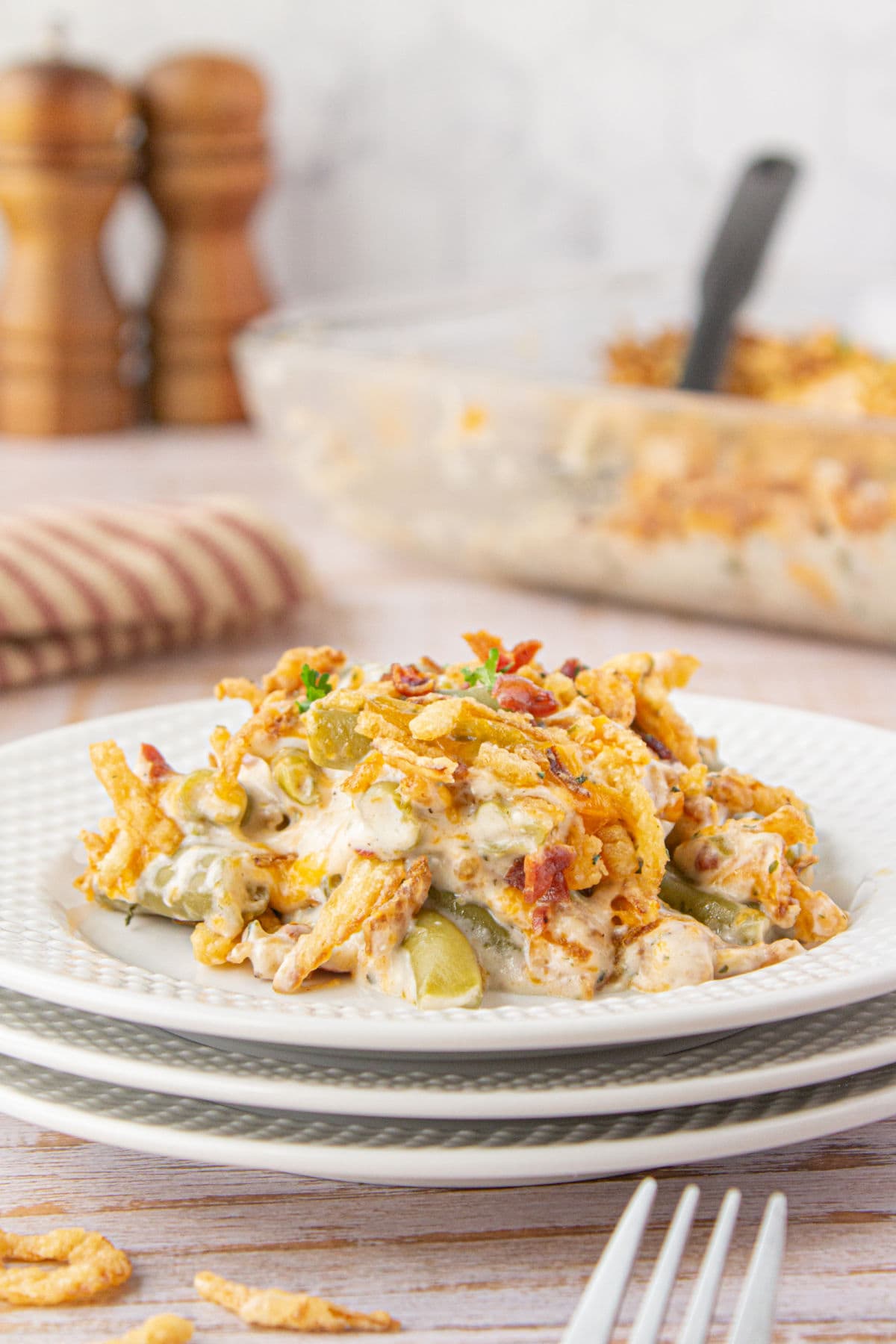 Serving of the casserole on a plate showing off the creamy sauce.