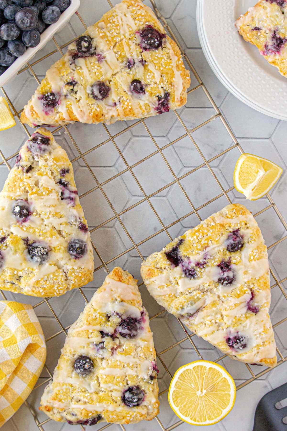 Lemon blueberry scones on a tray.