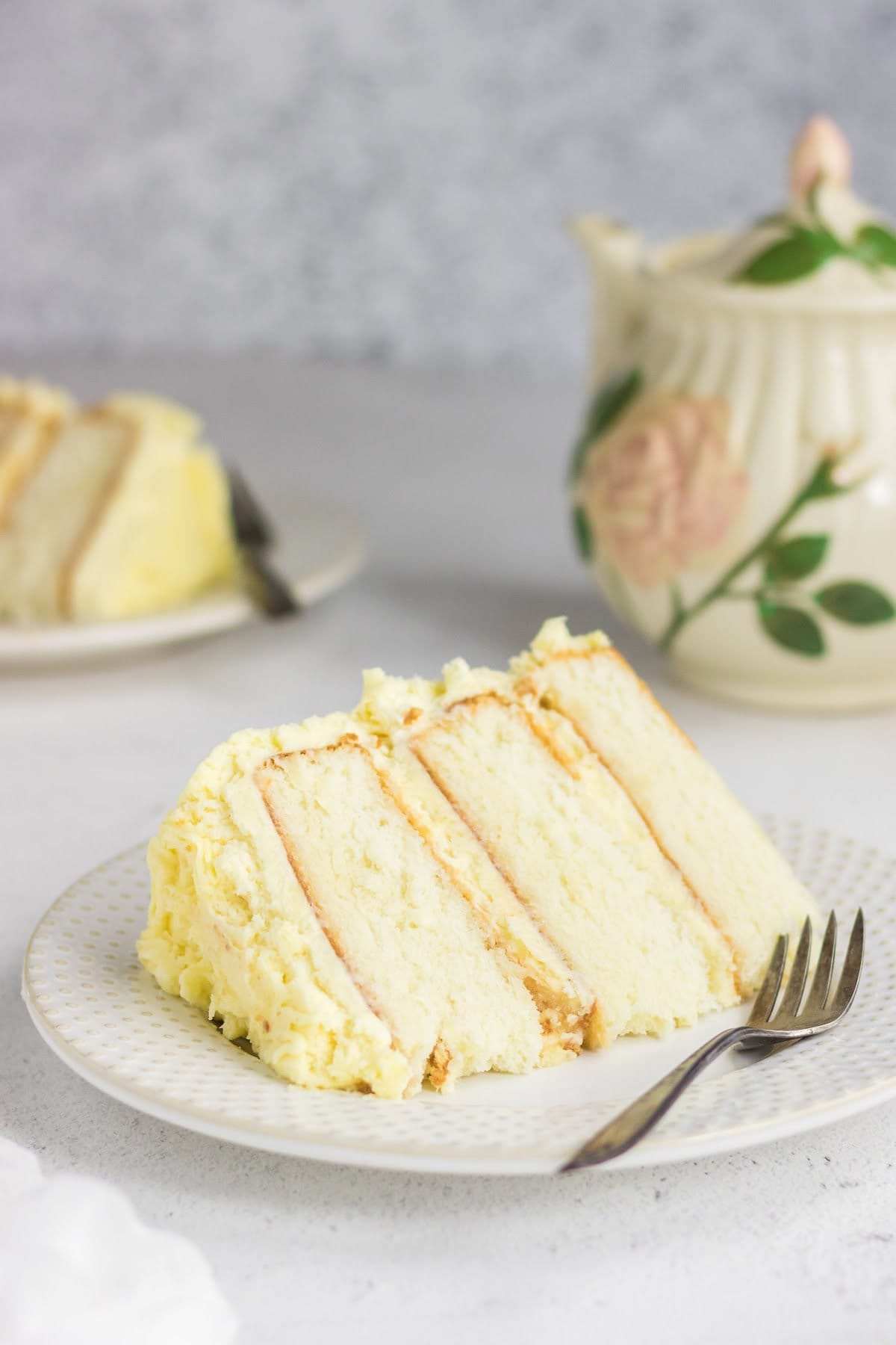 A slice of buttermilk layer cake on a plate.