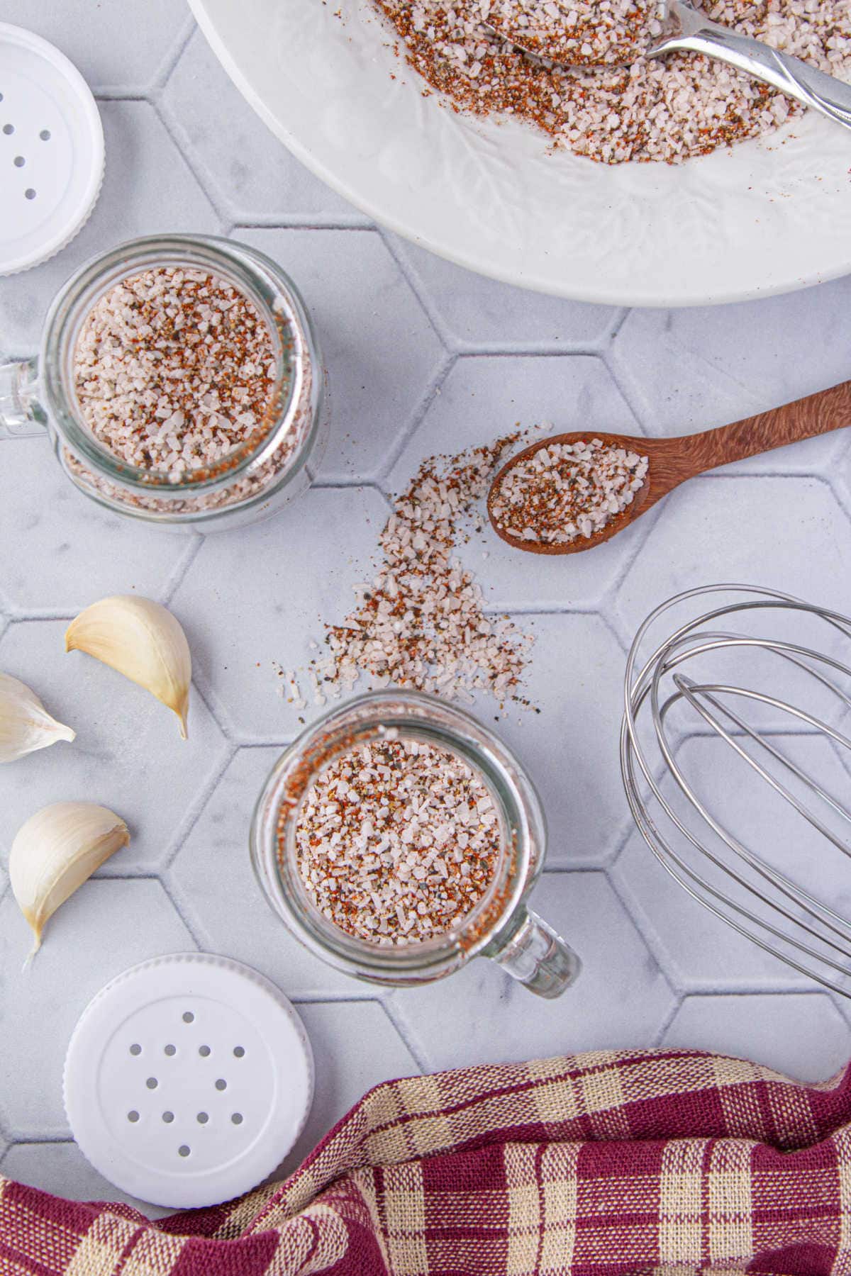 Overhead view of a table with the seasoning being mixed on it it.