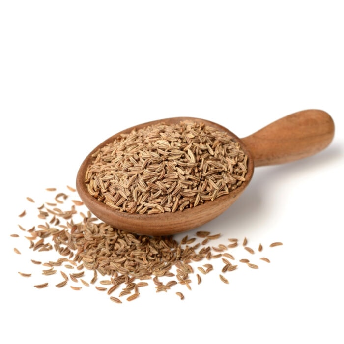 Caraway seeds in a spoon.