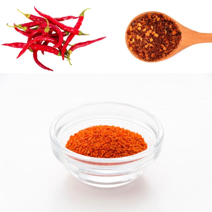 Cayenne peppers, ground cayenne and crushed red pepper on a white background.