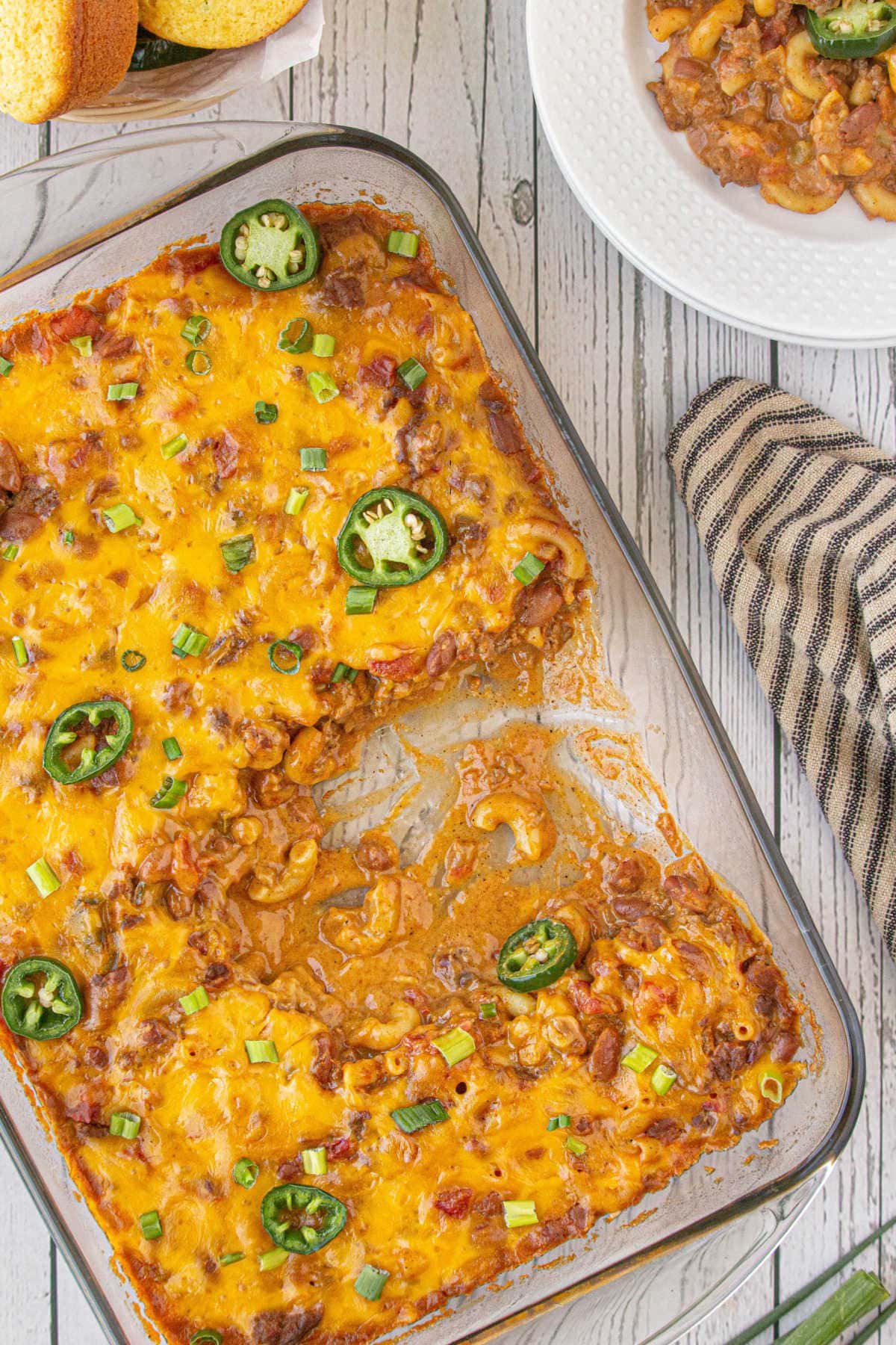 Casserole dish with a serving of chili mac removed.