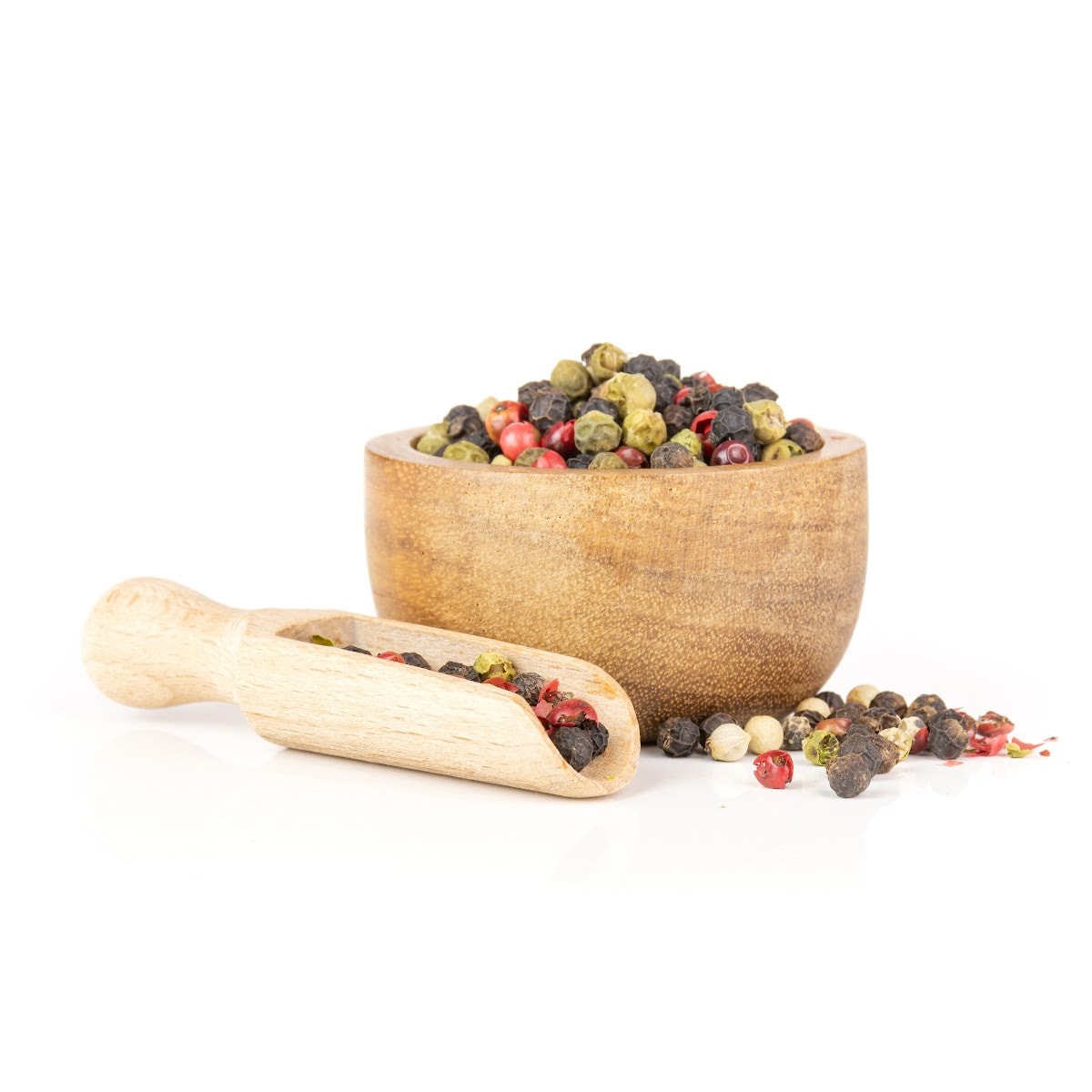 Multi-colored peppercorns in a bowl.