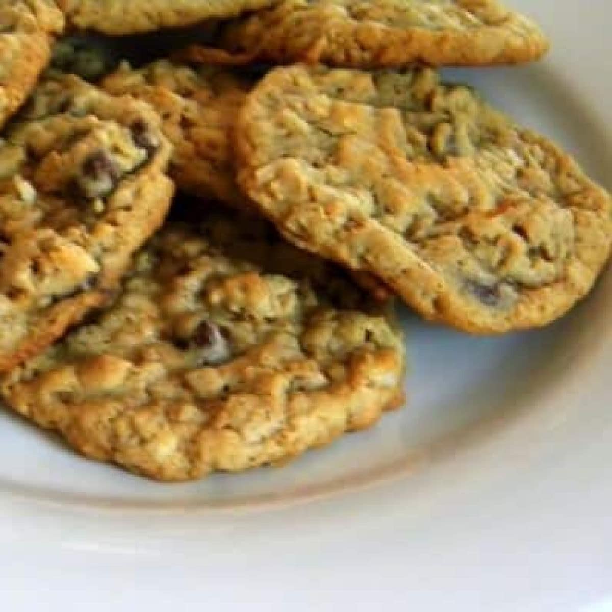 A stack of ranger cookies on a plate.