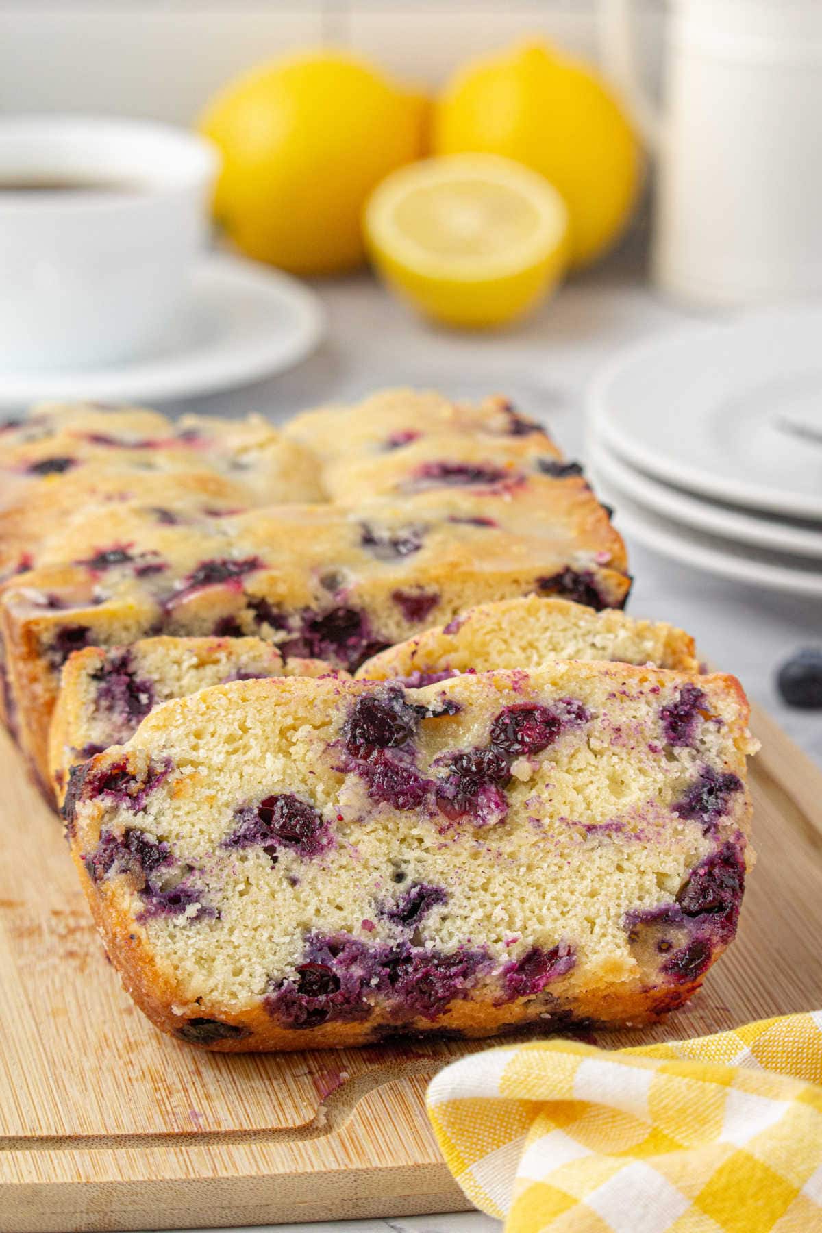 Slices of blueberry bread showing the moist, tender crumb and the juicy blueberries.