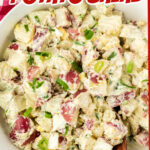 Closeup of a bowl of potato salad with text overlay for Pinterest.