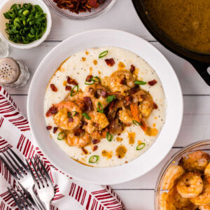 Overhead view of the finished shrimp and grits in a bowl for the featured image.