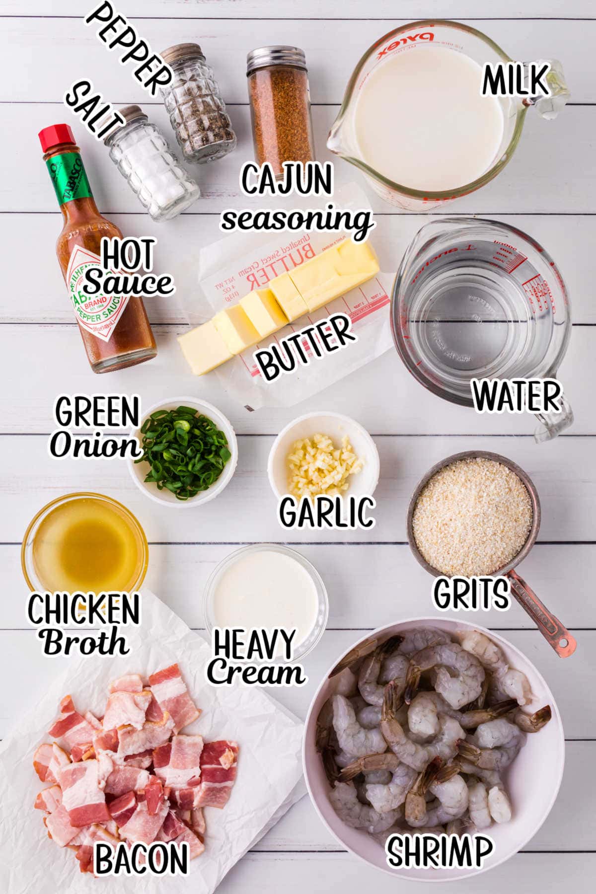 Labeled ingredients for shrimp and grits on a table.