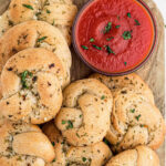 Overhead view of garlic rolls with text overlay for Pinterest.