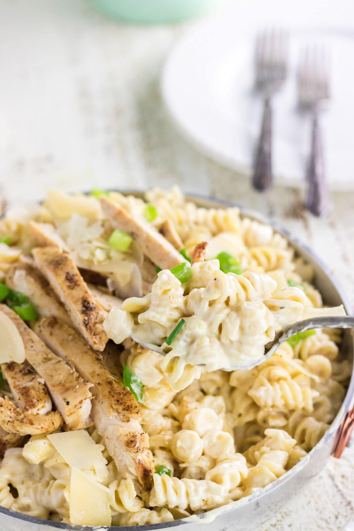 Closeup of chicken alfredo in the dish.