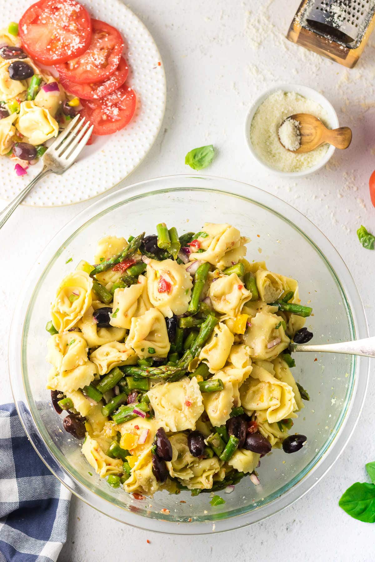 Overhead view of a bowl of tortellini salad on a table.