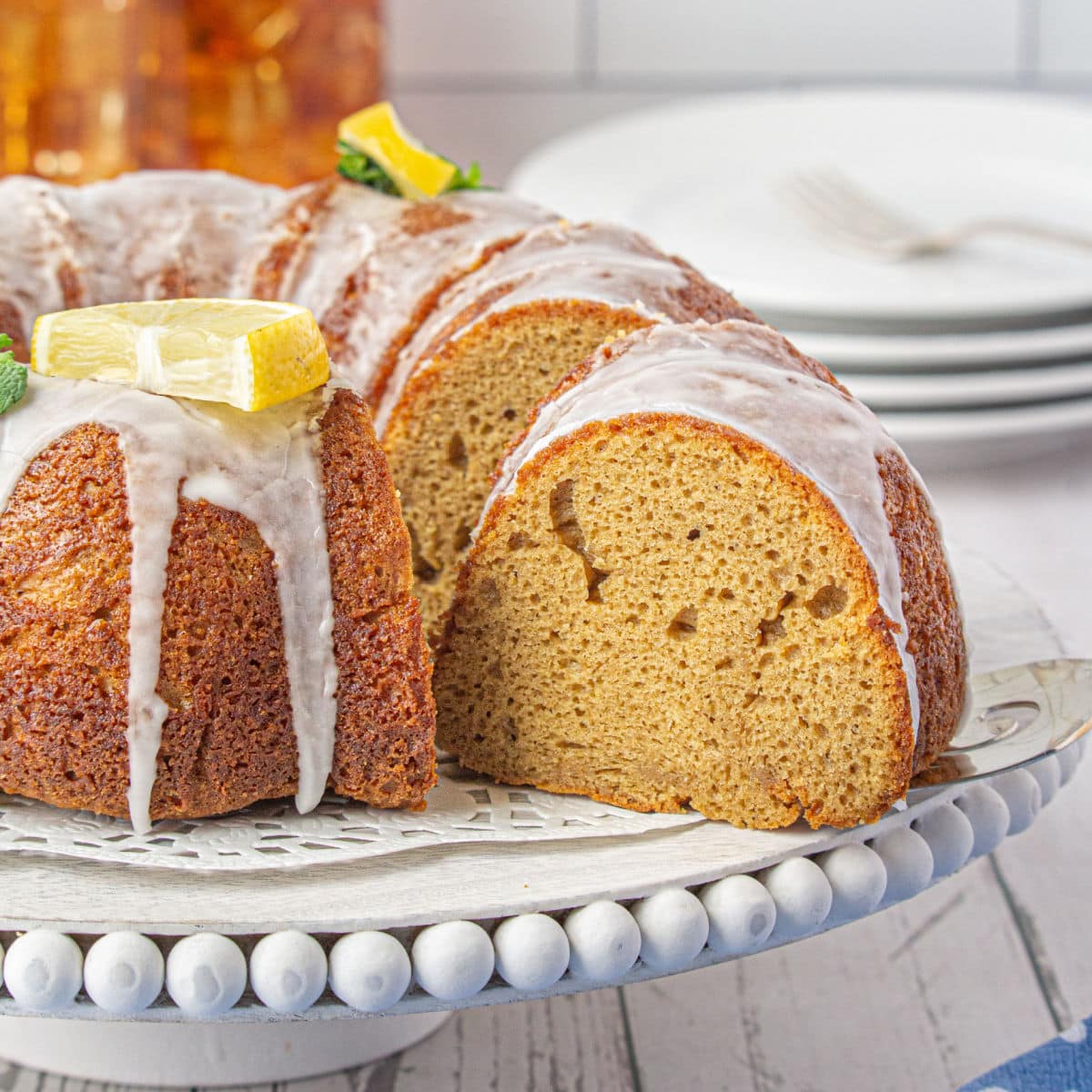 Close up of a cake with a slice being removed.