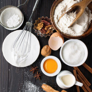 A ground of ingredients on a dark wood table.