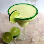 Key lime pie margarita on a table.