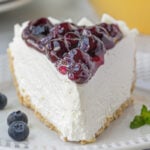 Closeup of the blueberry topping on the cheesecake.