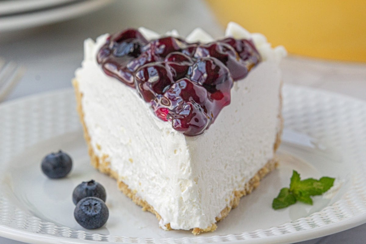 Closeup of the blueberry topping on the cheesecake.