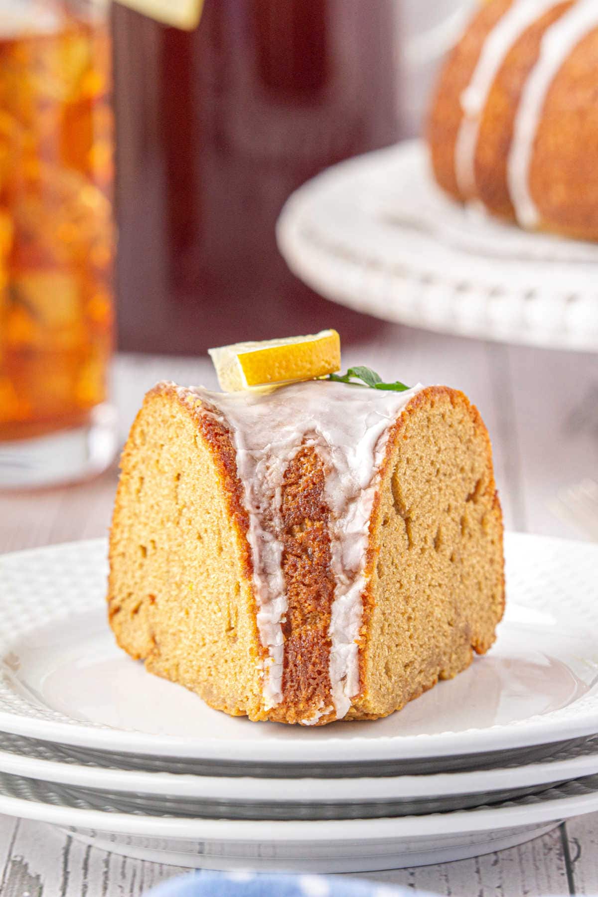 A wedge of cake on a white plate.