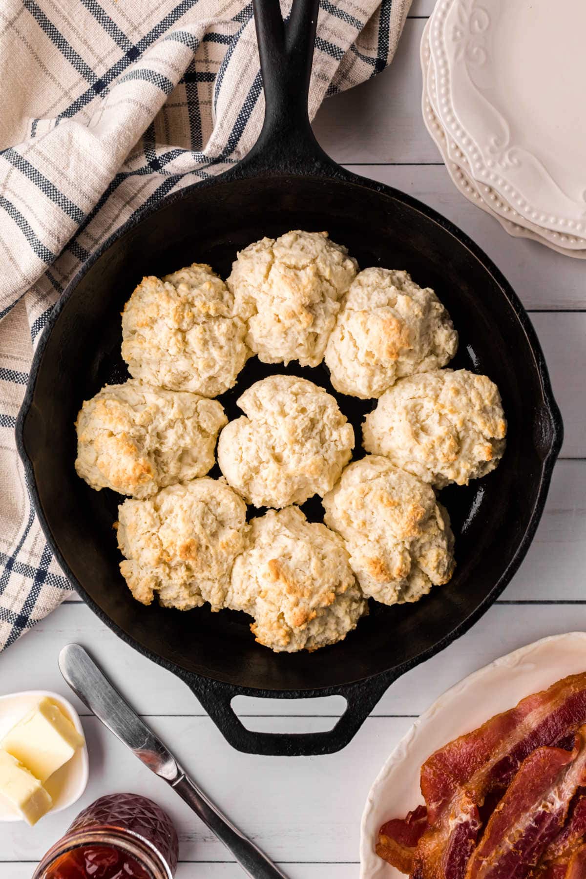 Overhead view of biscuits in an iron skillet.