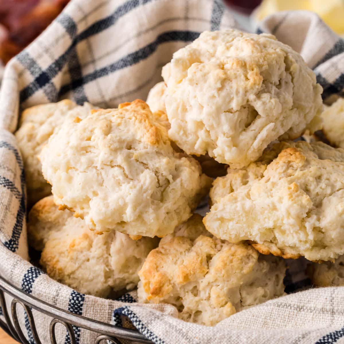 Close up of finished biscuits in a basket showing the bumpy texture.