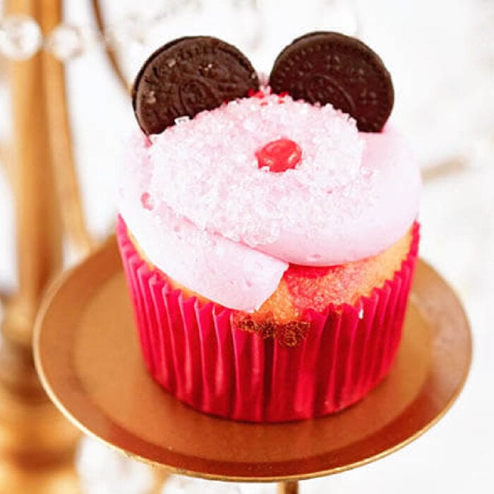 Pink frosted cupcakes with Oreos for mouse ears.