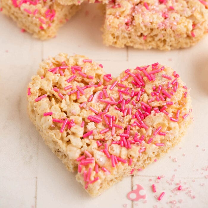 Heart-shaped Rice Krispie Treats with pink sprinkles.