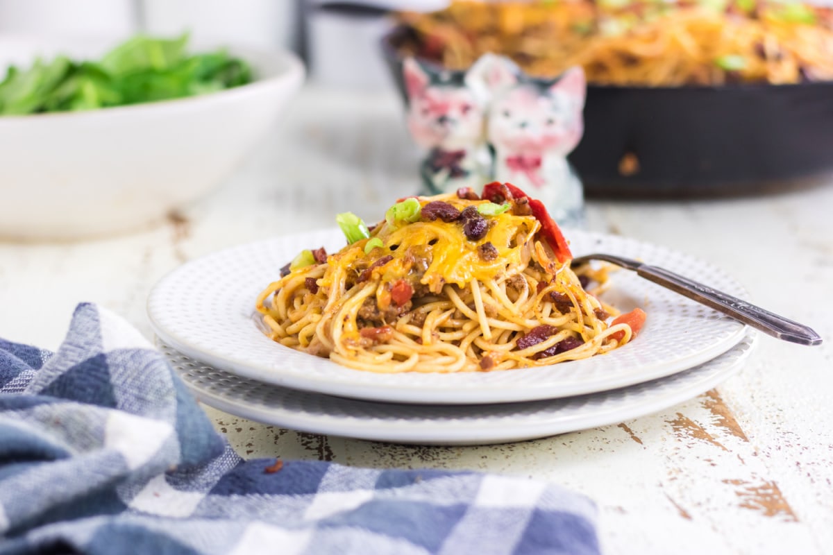 A pile of pasta on a white plate.