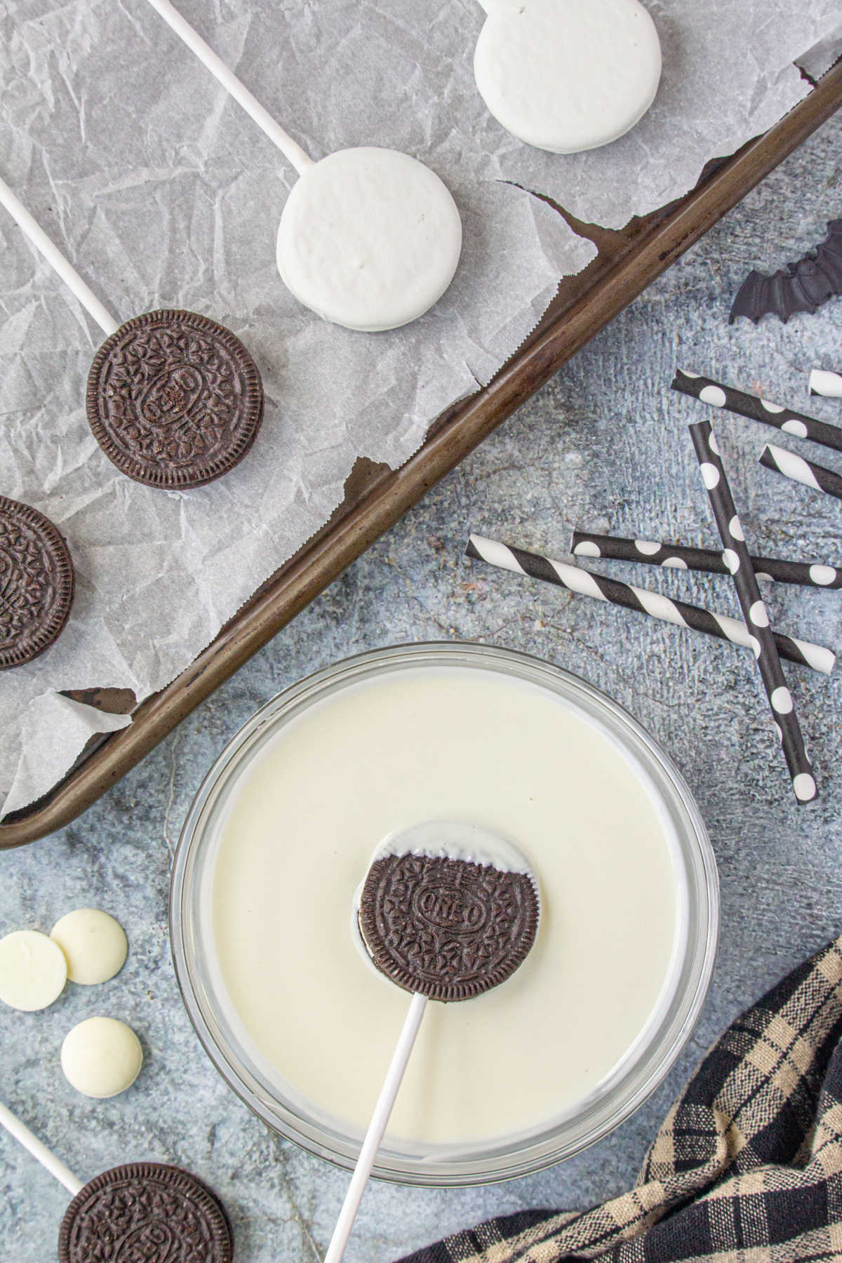 Dipping Oreos in the melted white candy melt mixture.