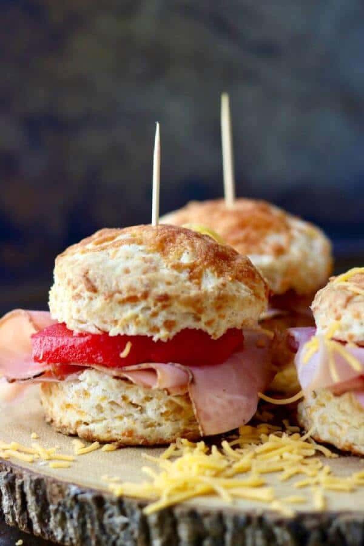 Closeup of ham biscuits with cinnamon apples.