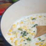 A pot of corn chowder with a title text overlay for Pinterest.