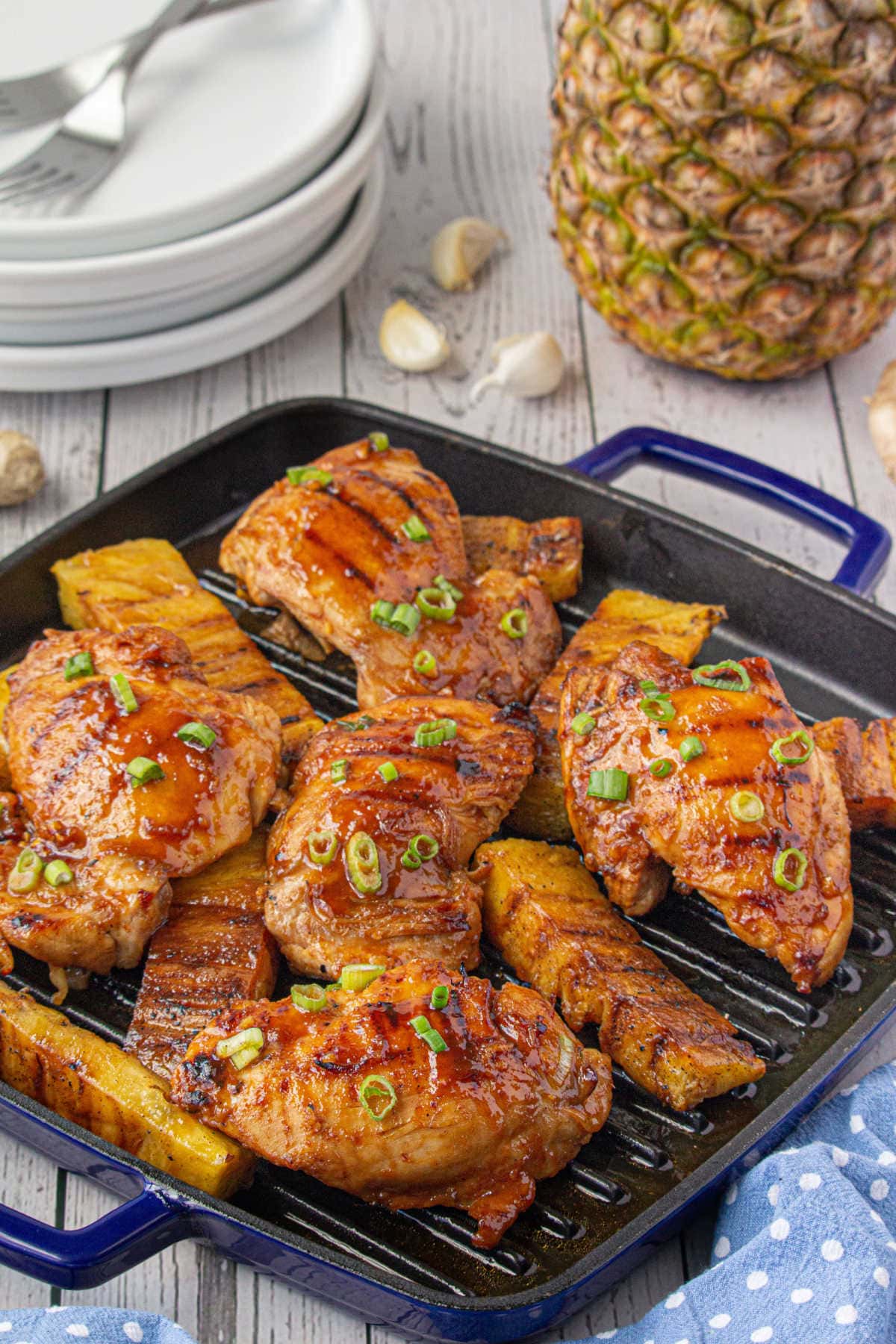 A grill pan with finished chicken on it.