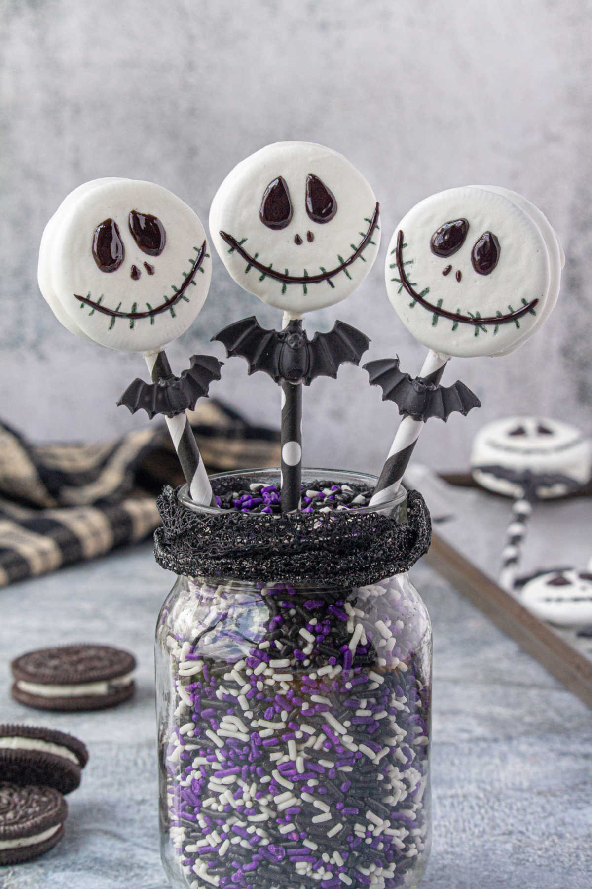 Finished Jack Skellington Oreo Pops in a jar.