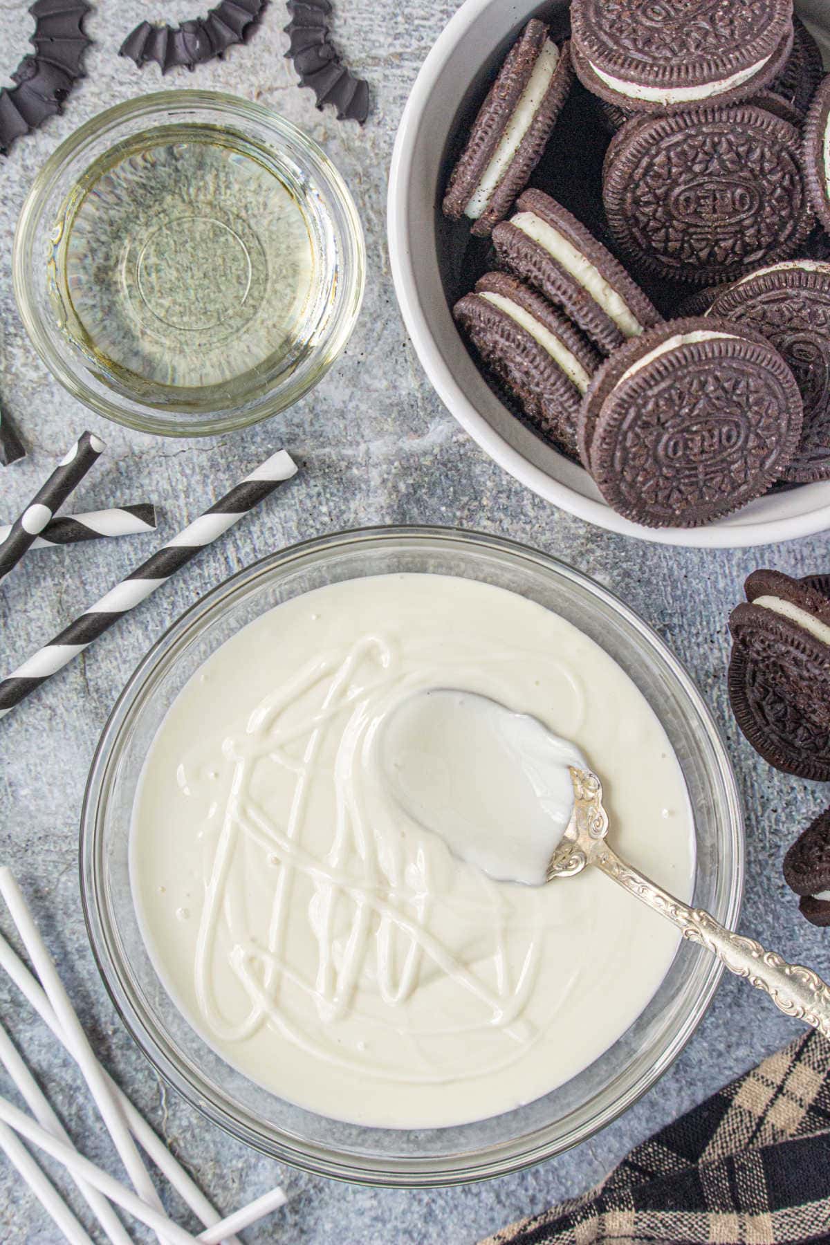 Coconut oil being stirred into melted candy melts.