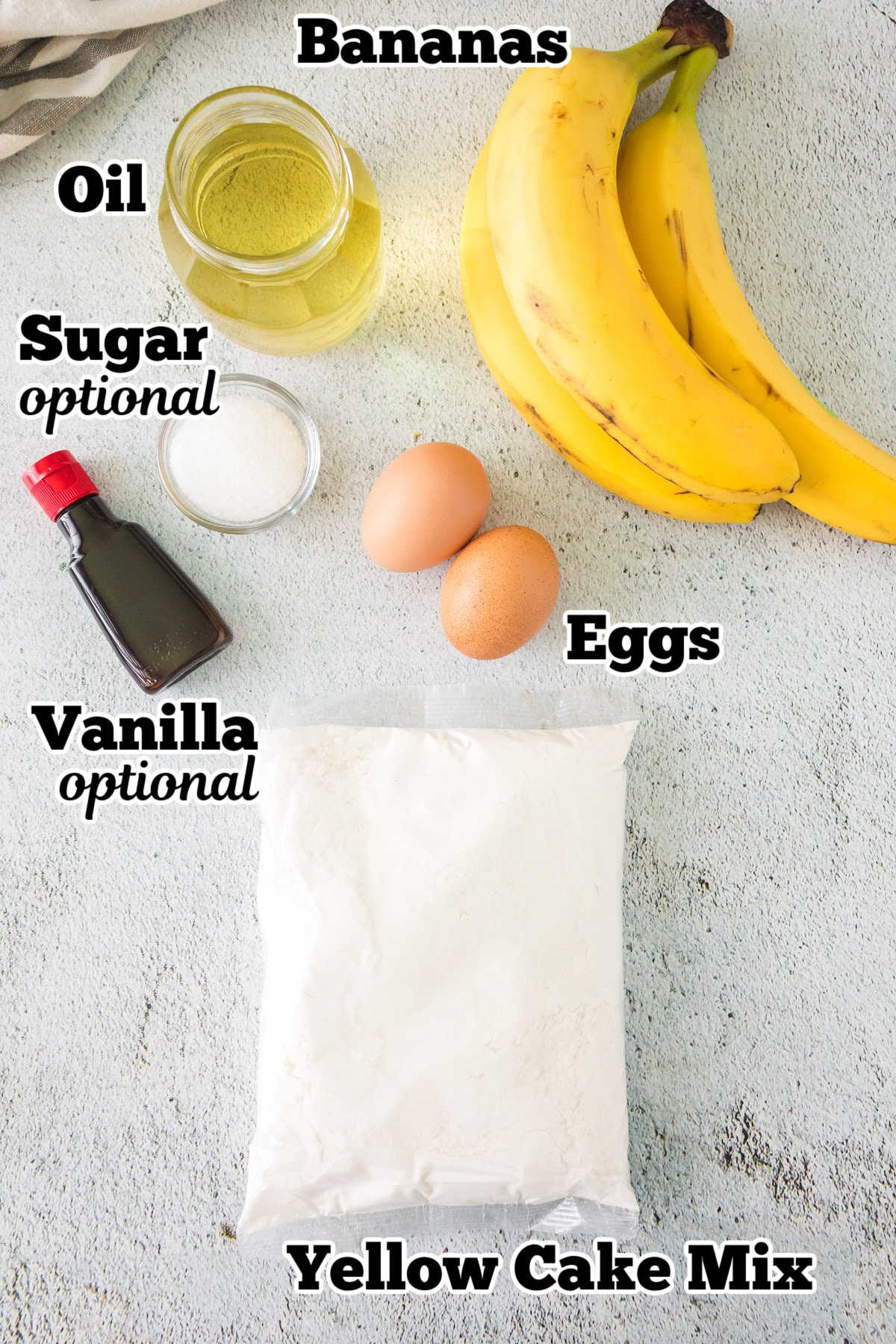 Labeled ingredients for this banana bread recipe on a white background.